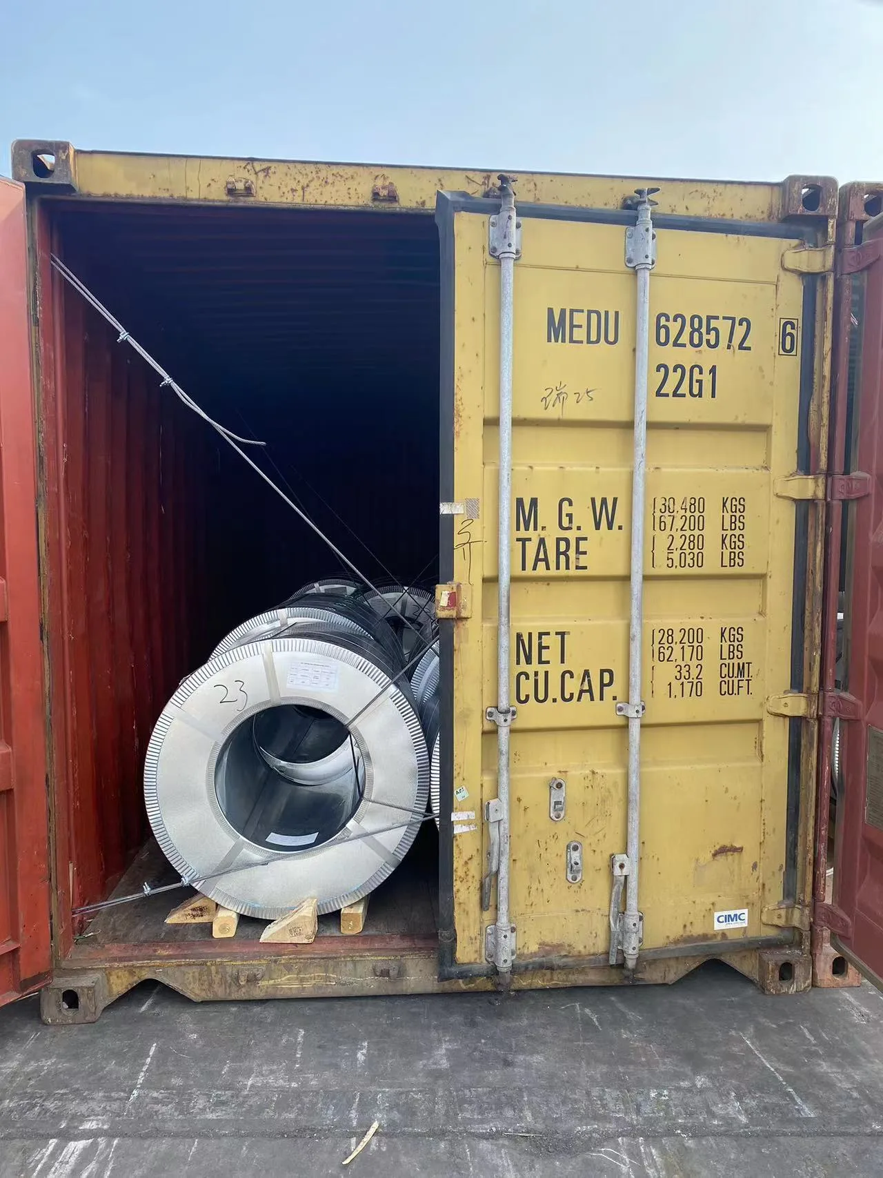 Packed galvalume steel coils loaded into container for international sea shipment