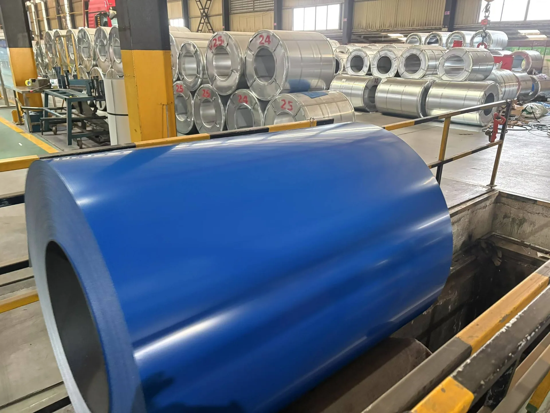 Close up of PPGI pre-painted galvanized steel coil showing RAL color surface and coating quality