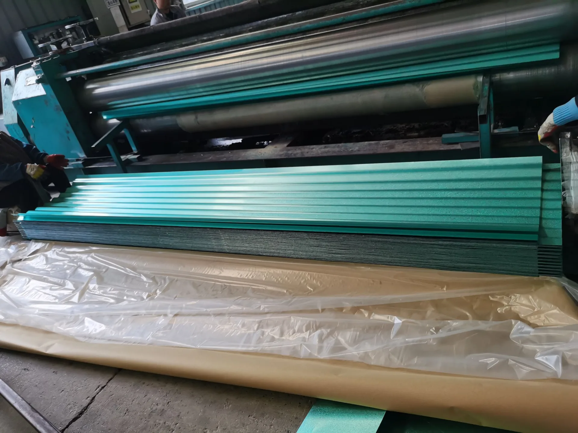 Corrugated steel roofing sheet from coated coil